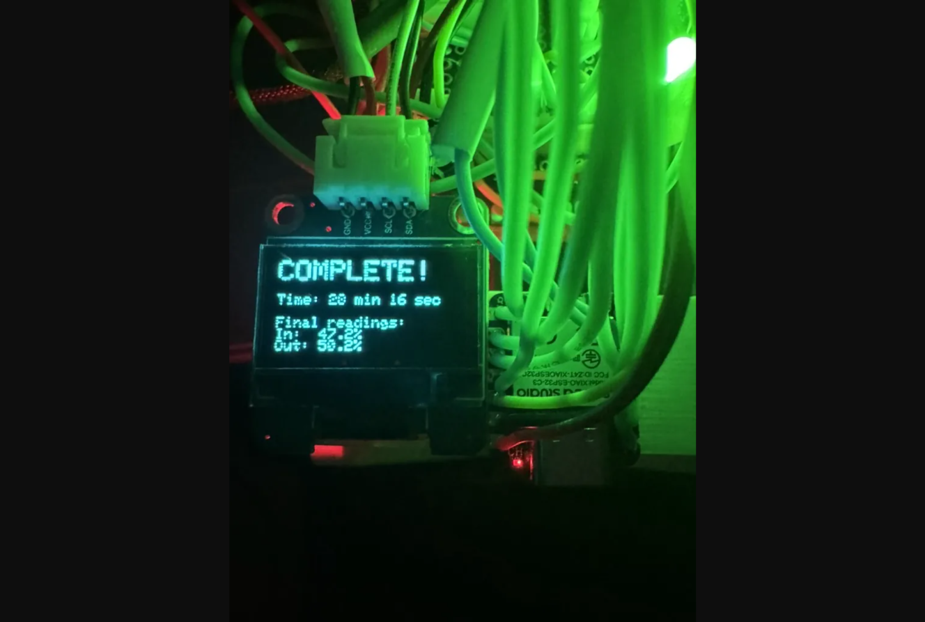 OLED display showing COMPLETE! — 28 minutes 16 seconds, final humidity readings